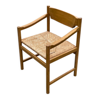 Vintage chair with webbing and papercord rope from the 70s minimalist design.