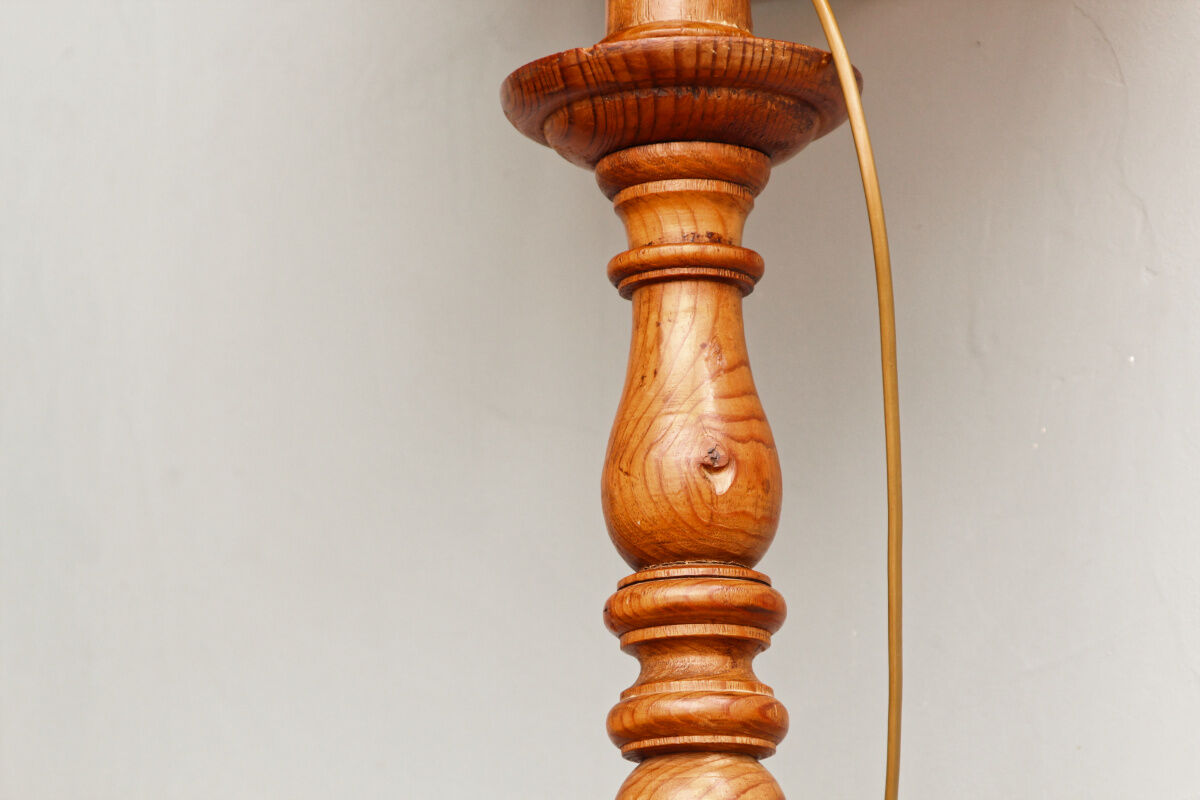 Carved wooden lamp, fiber shade
