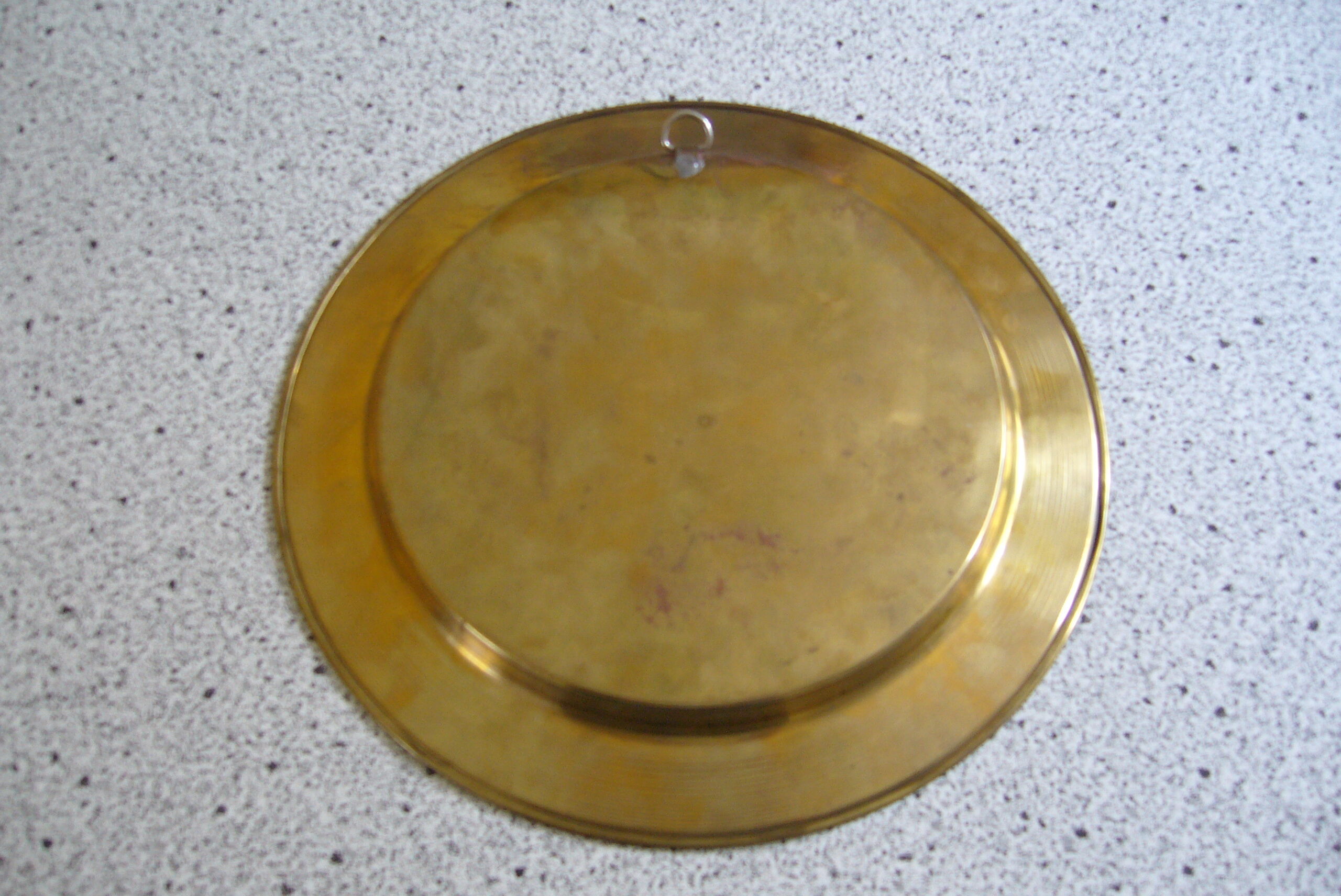 Oriental style chiseled metal plate