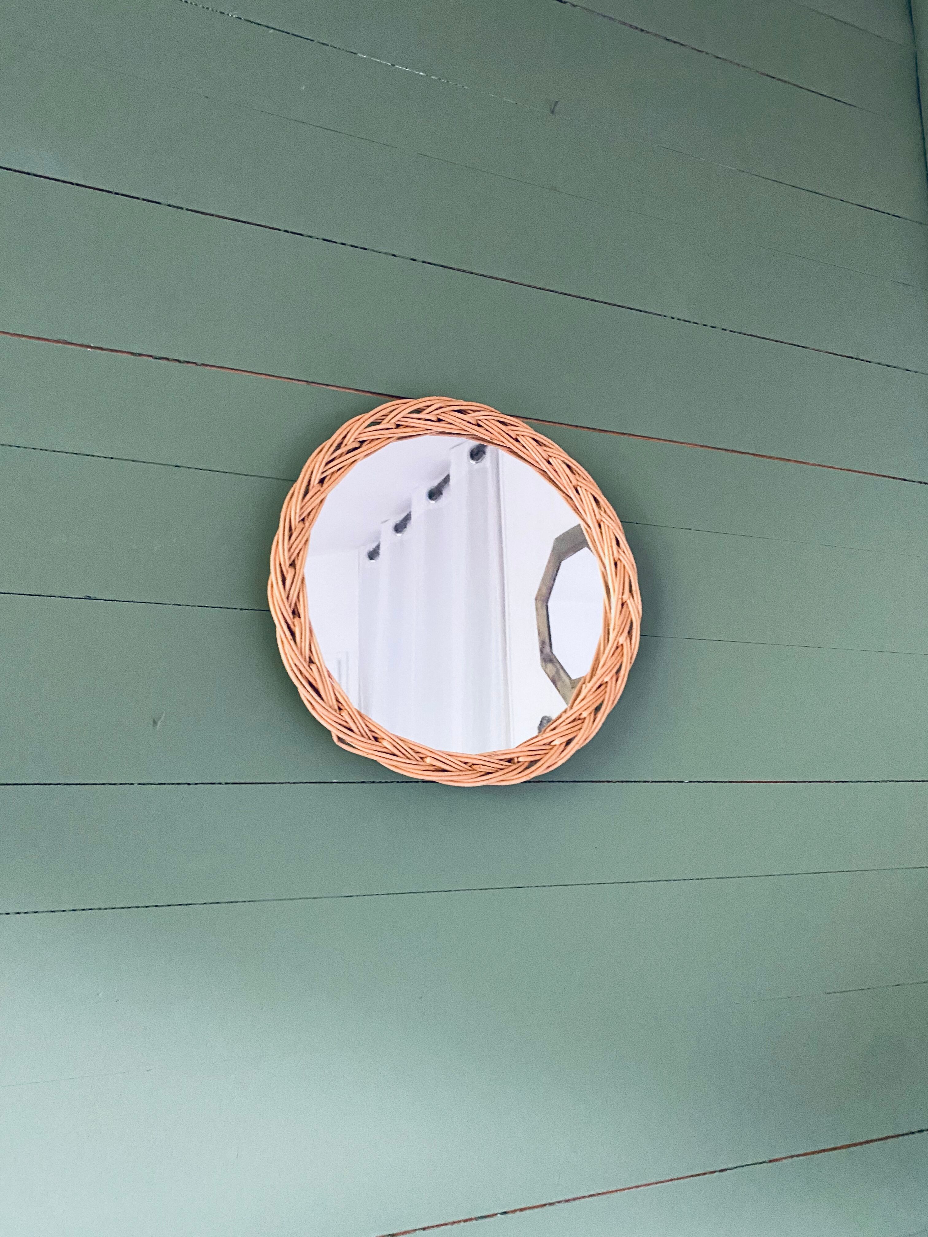 Round mirror in vintage wicker