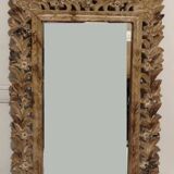 Mirror with its openwork frame