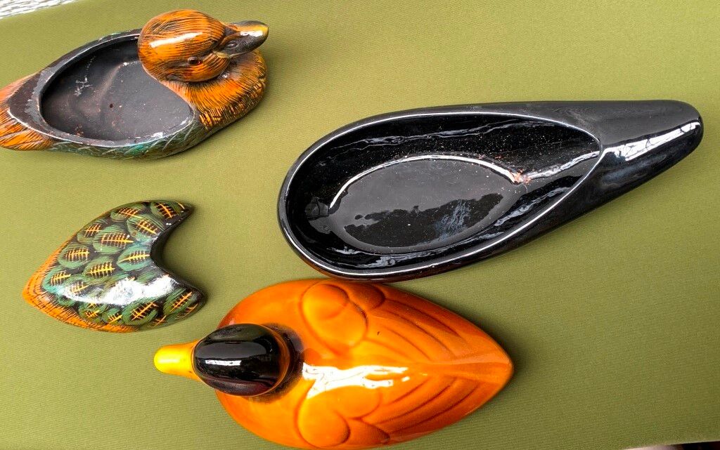 Enamelled terracotta boxes in the shape of ducks.