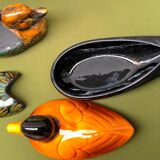 Enamelled terracotta boxes in the shape of ducks.
