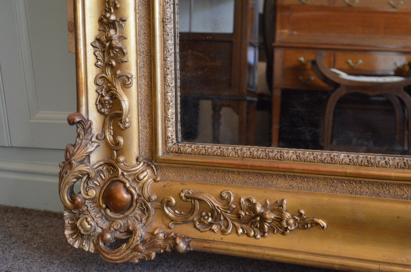 Nineteenth century monumental mirror in gilded wood
