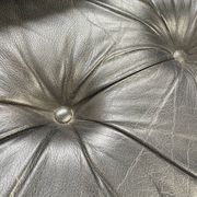 Pair of black leather armchairs