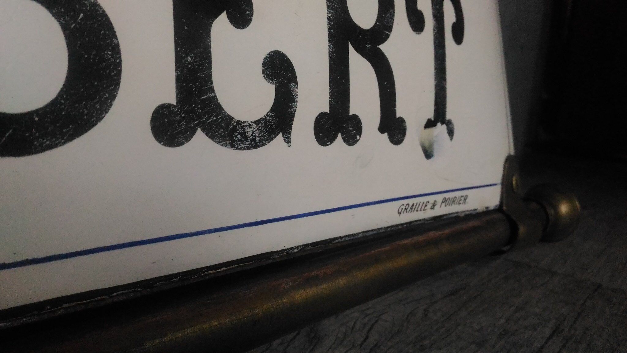 Photographer enamel sign