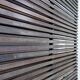 Slatted wood panel room divider or slatted coat rack with 10 mobile hooks