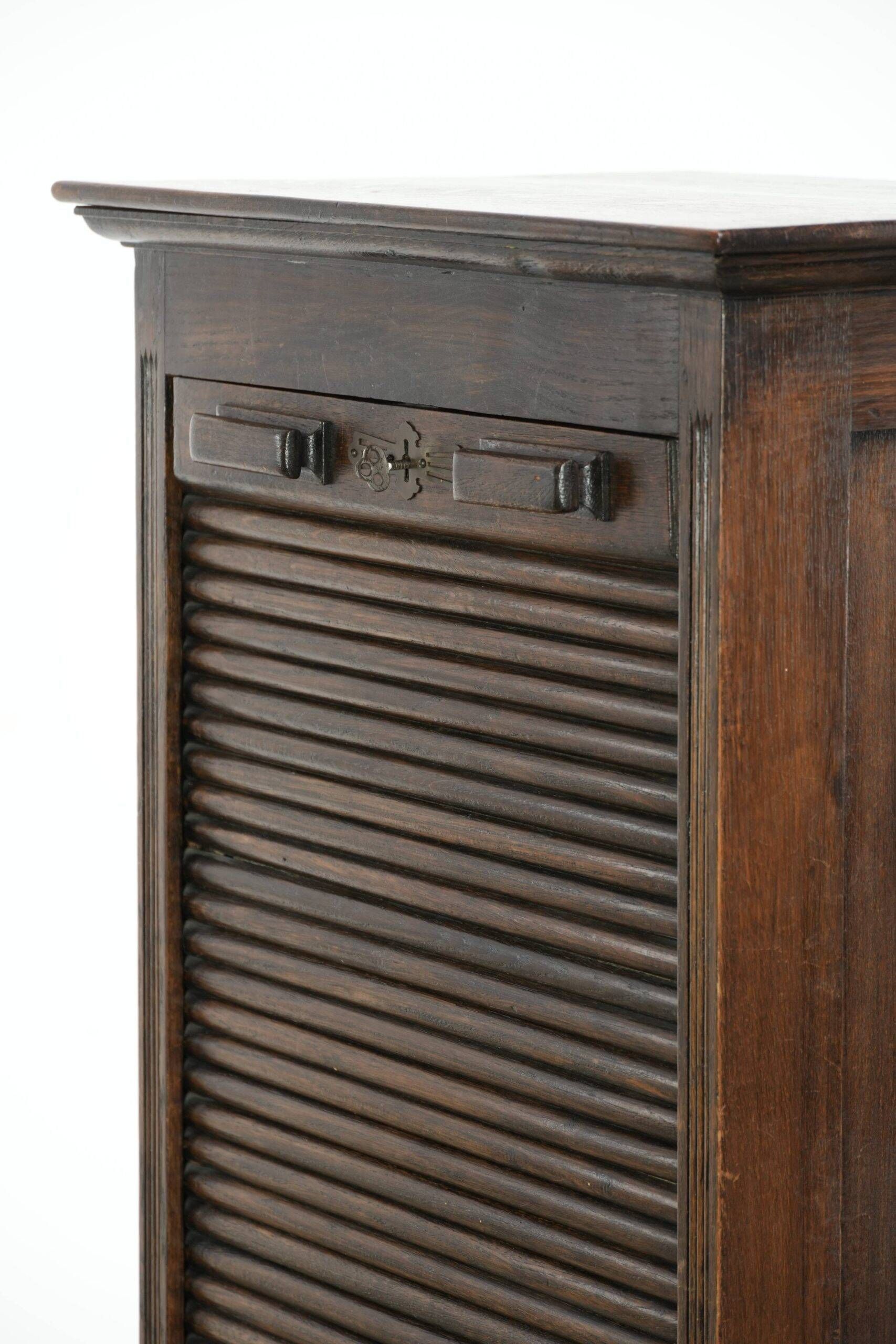 English antique archive cabinet with oak roll-up door from the 20th century
