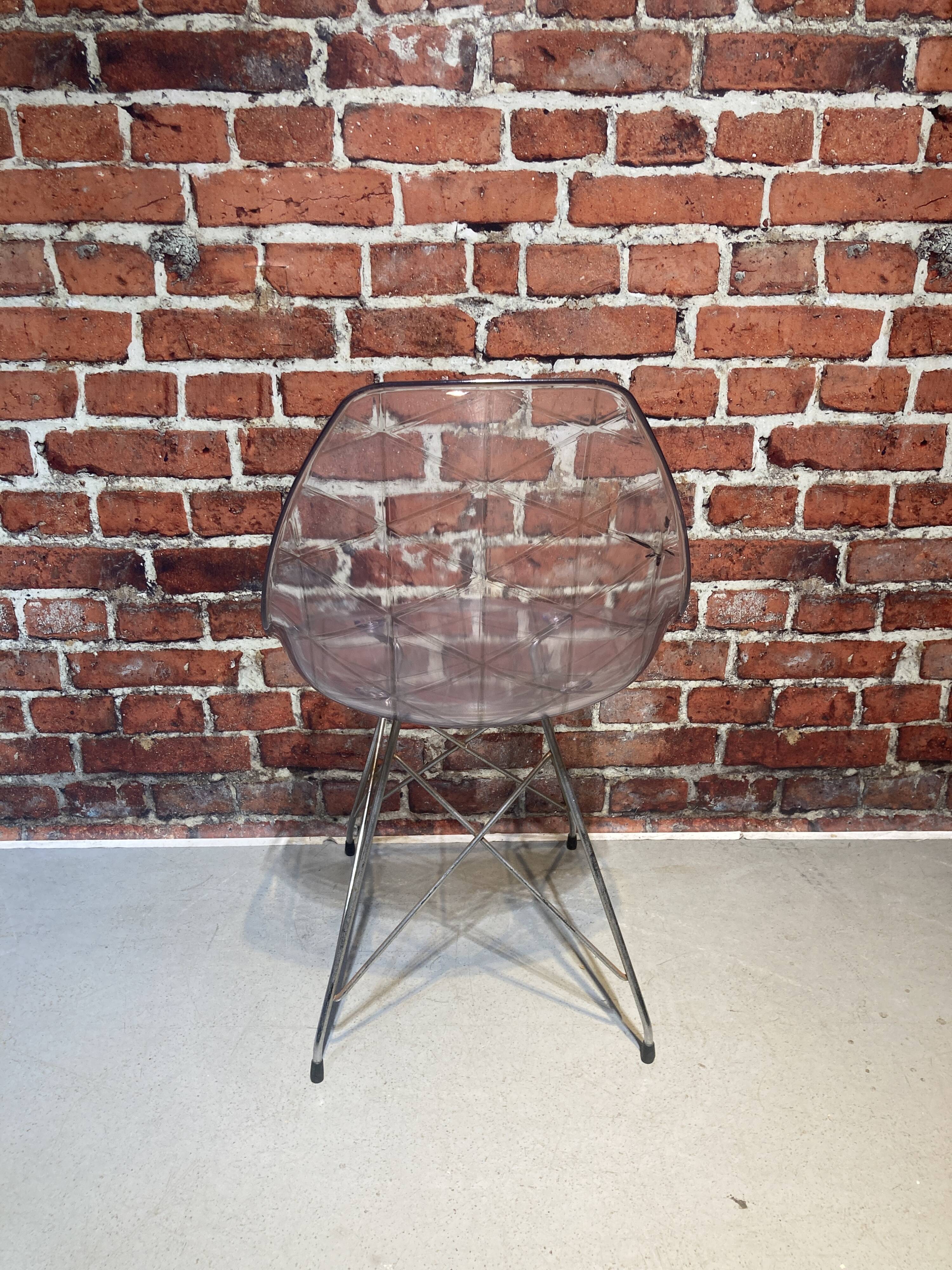 Set of four plexiglass and metal chairs