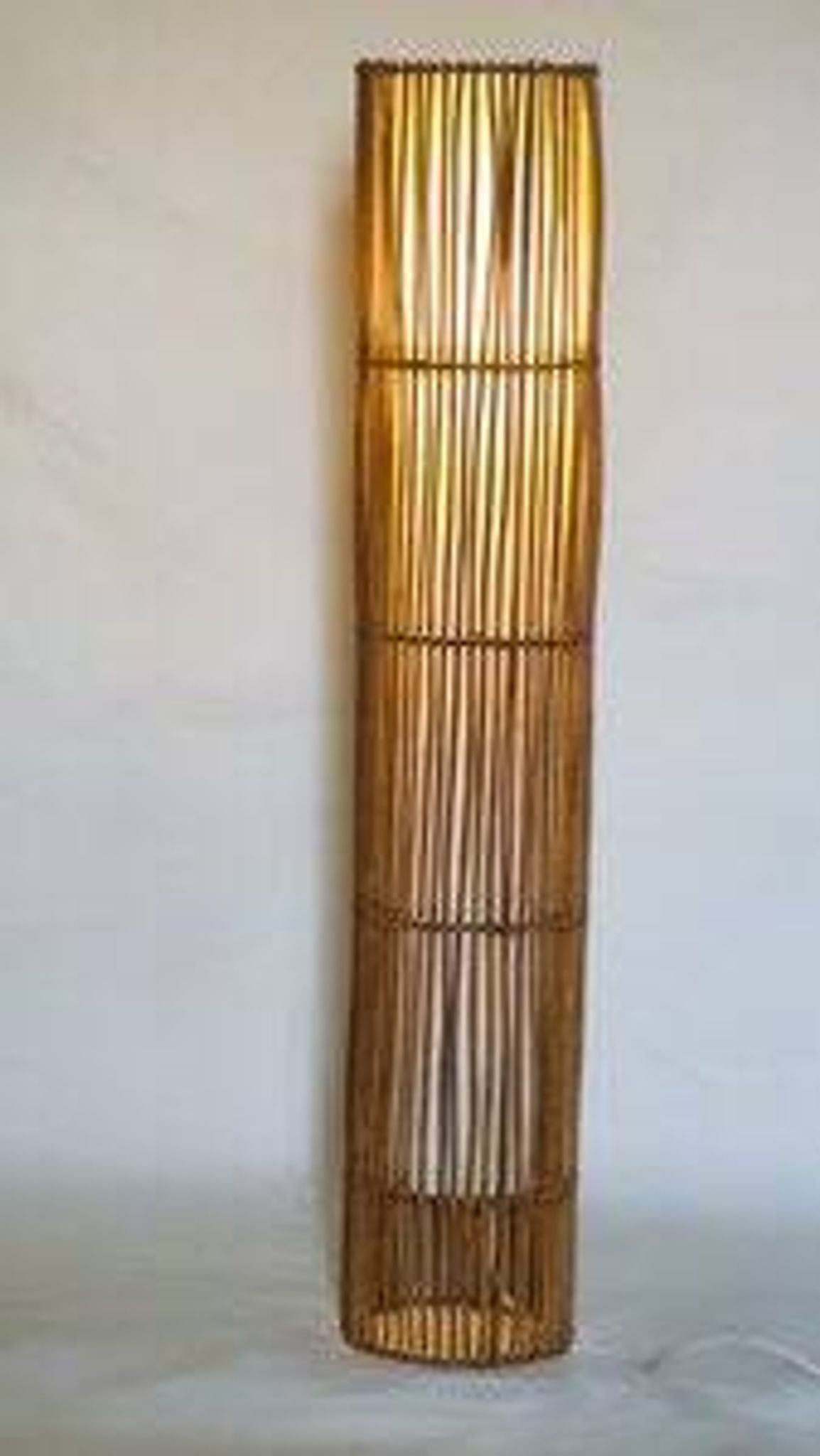 Mid-century rattan floor lamp, in the style of Louis Sognot.