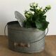 Old zinc stud, fisherman's live bucket