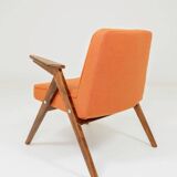 Fauteuil lounge vintage en laine, tissu orange et bois de hêtre