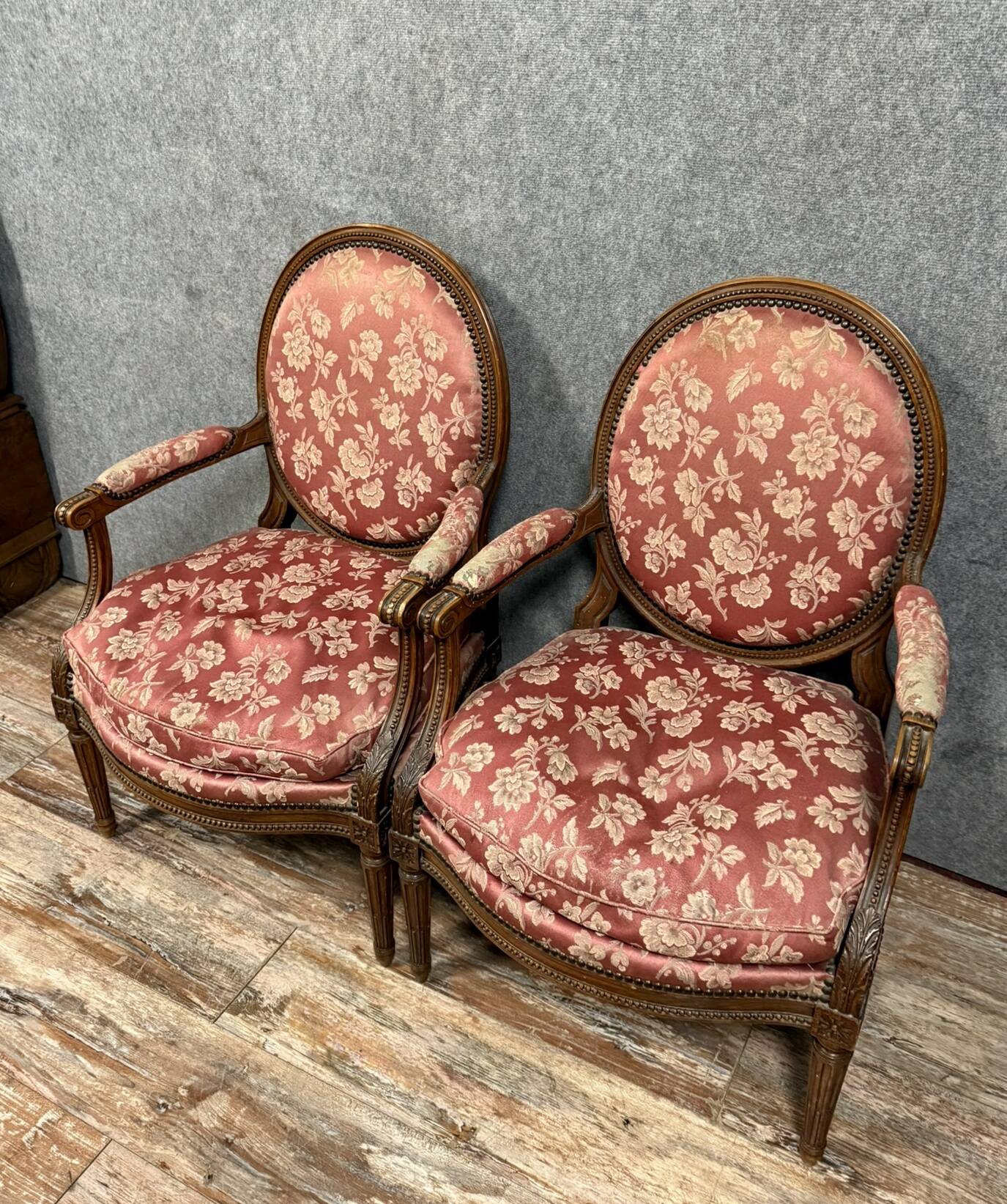 Pair of Louis XVI style armchairs in carved wood circa 1850
