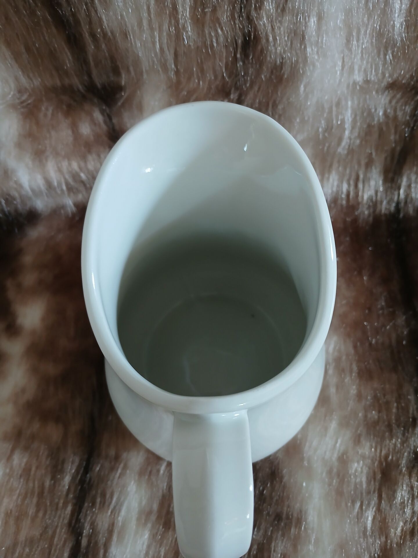 2 antique pitchers in white earthenware