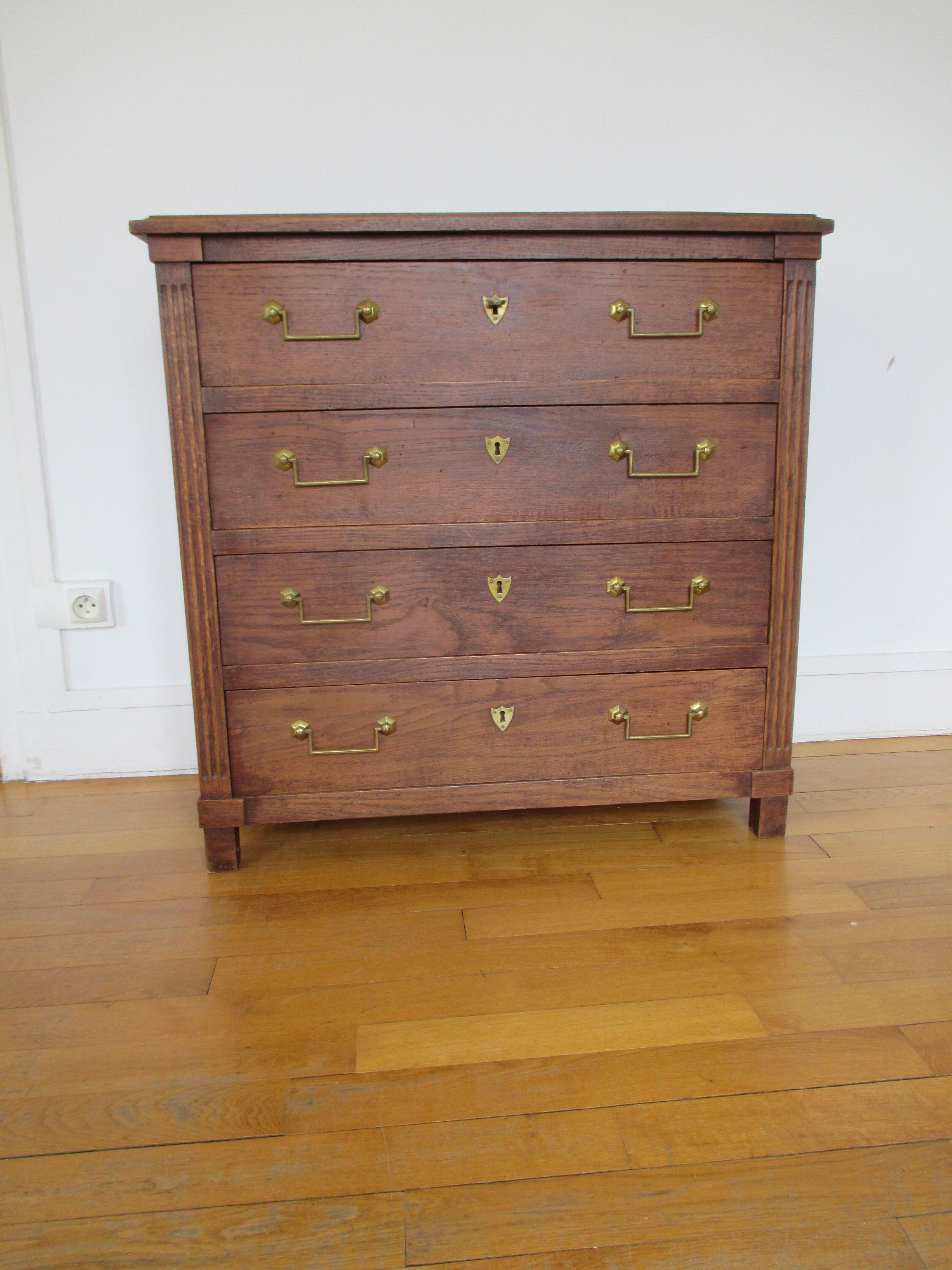 Oak chest of drawers and brass handles