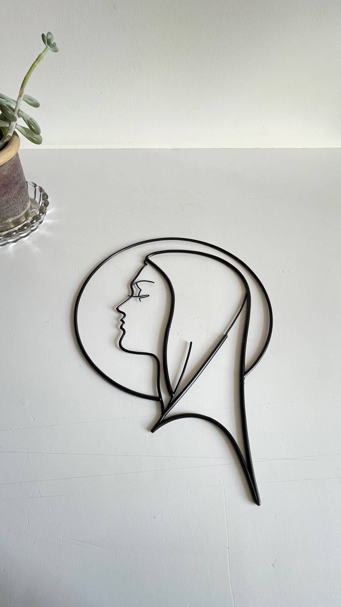 Vintage modernist wall decoration image of Saint.