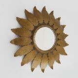 Old sun mirror with foliage in gilded metal with twisted frieze from the 60s