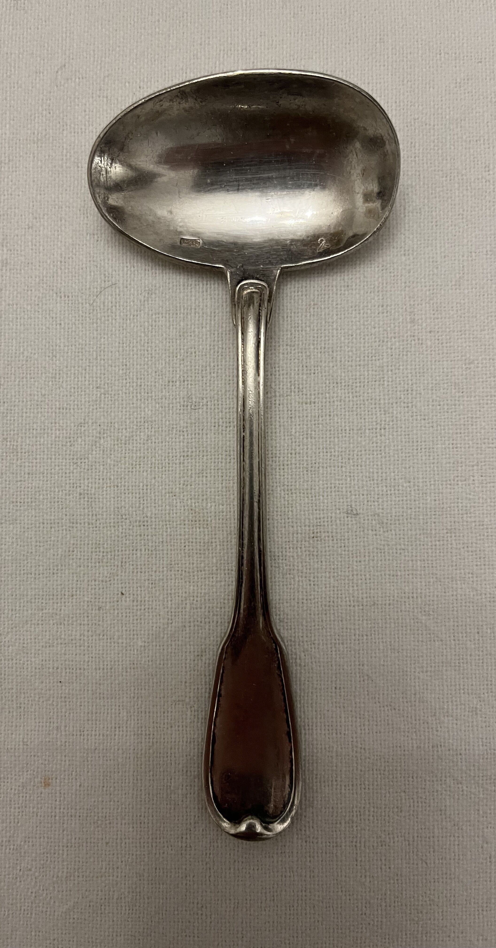 Silver metal sauce spoon
