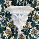 Antique wall console in patinated white plaster.