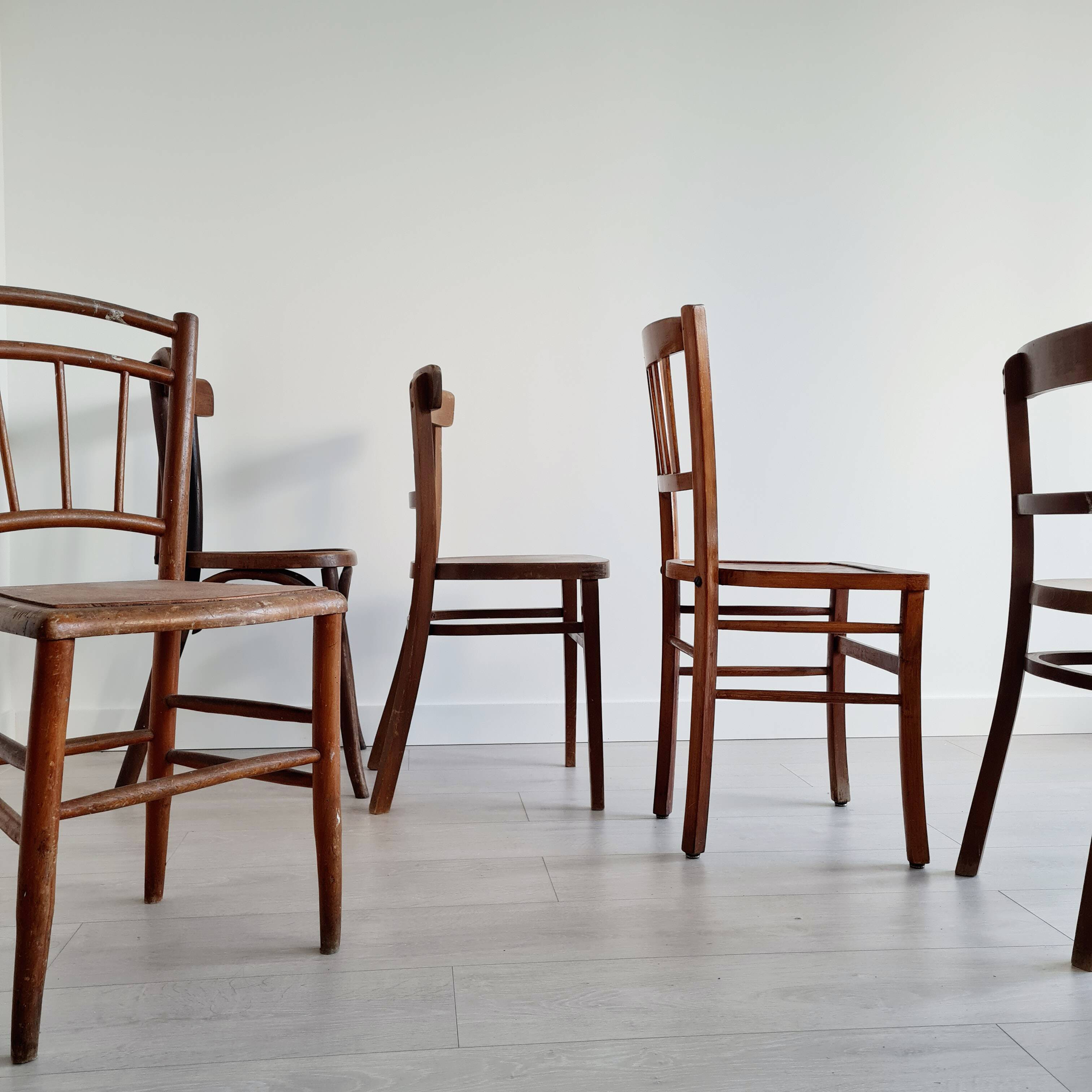 Mismatched wooden bistro chairs