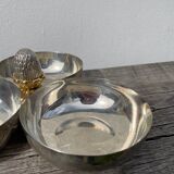 Silver-plated metal dish topped with an acorn