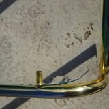 Nested tubular tables in gold metal.