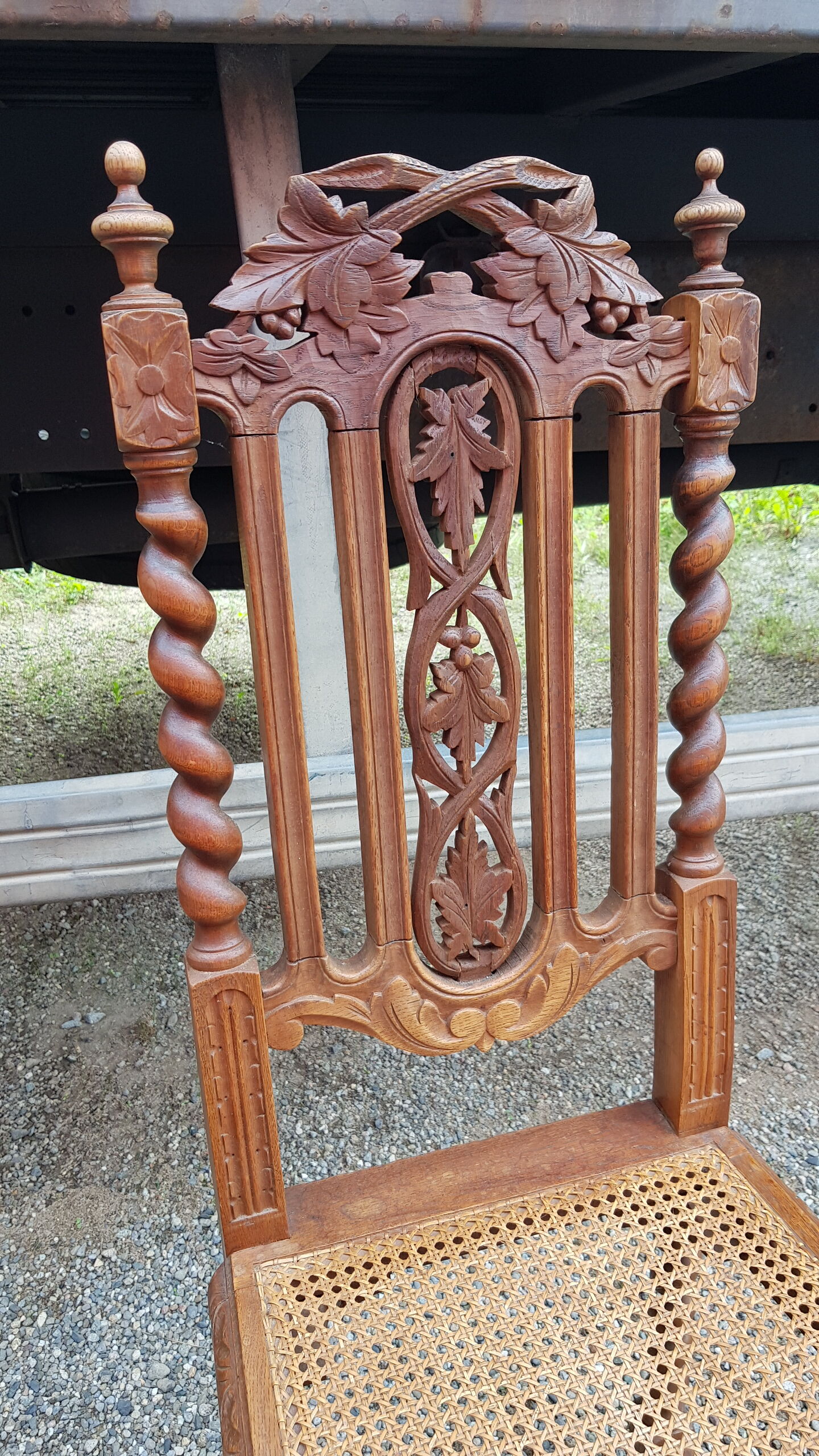 Carved antique chairs with rattan seat