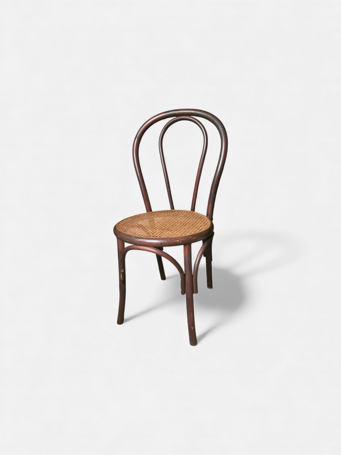Vintage bistro chair in bent beech, caned seat – Thonet spirit