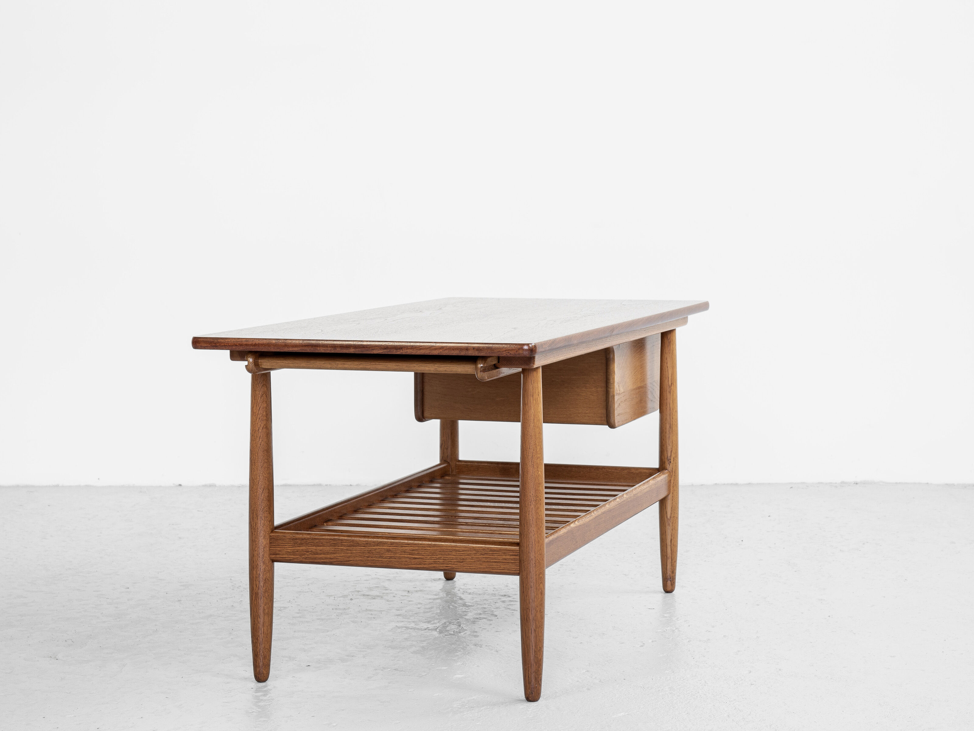 Midcentury Danish coffee table in oak and teak by Ejvind A. Johansson for FDB