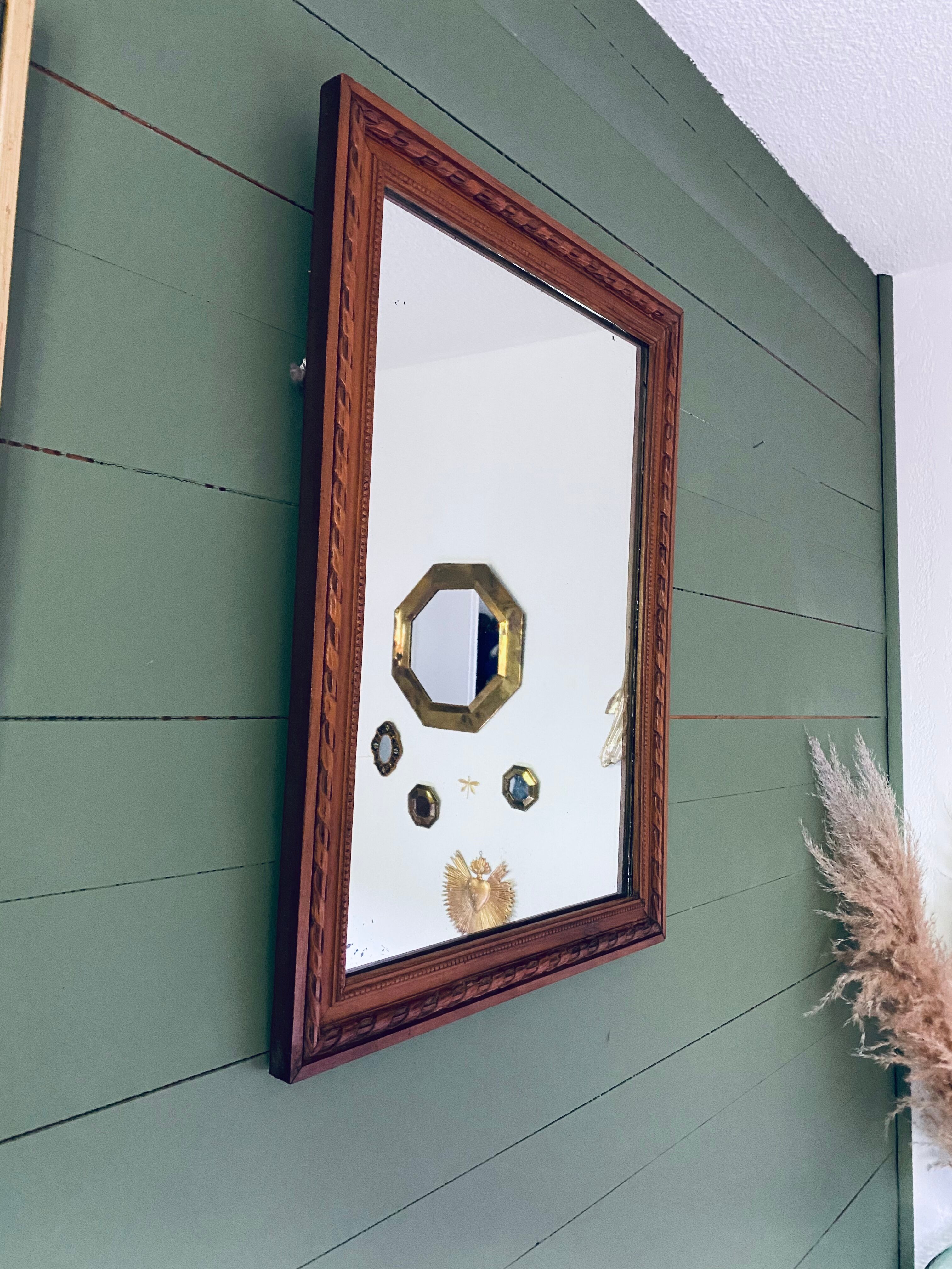 Antique mirror in carved wood and mercury 48x63cm