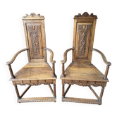 Pair of carved walnut armchairs in Renaissance style