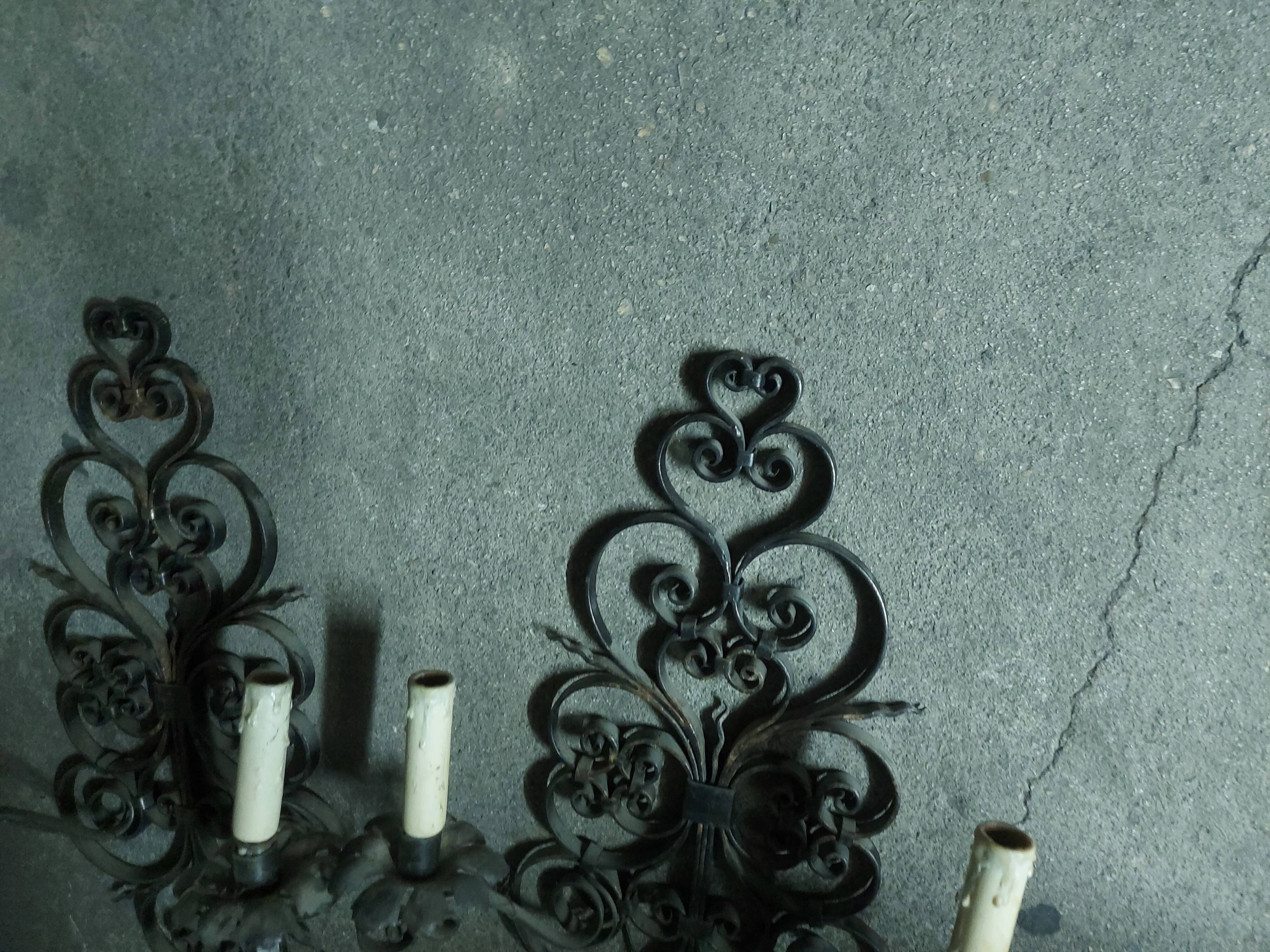 Two large wrought iron wall lights