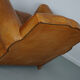 Vintage french moustache back cognac-colored leather club chair