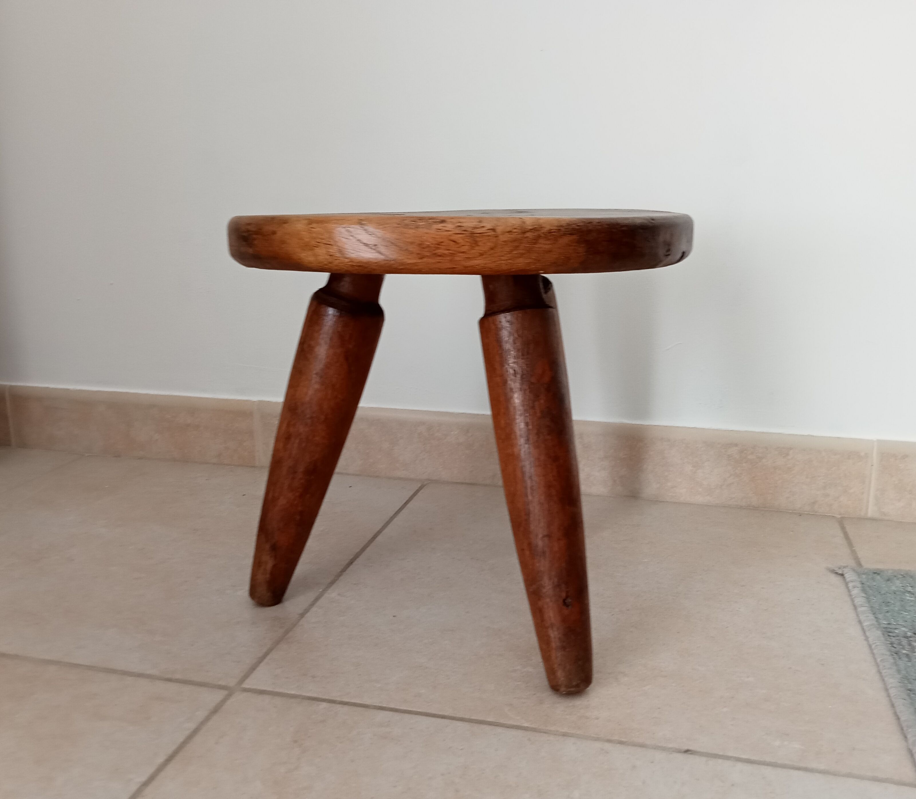 Antique walnut milking stool