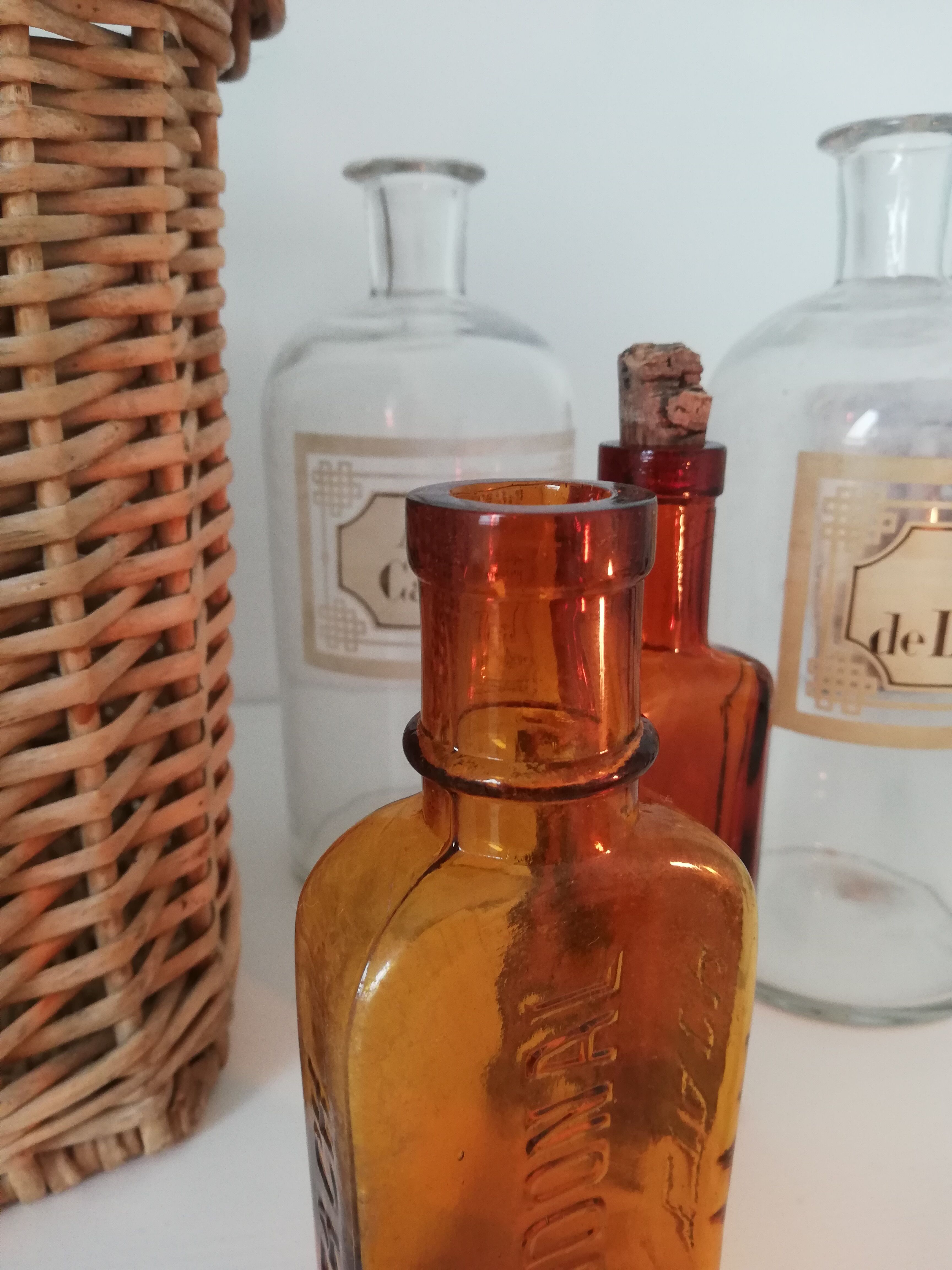 2 amber apothecary bottles