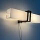 Simple white plexiglass wall light with a black metal frame, 1970s, Germany.