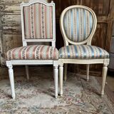 Pair of Louis XVI style chairs in painted wood and satin, classic elegance.