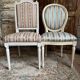 Pair of Louis XVI style chairs in painted wood and satin, classic elegance.