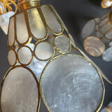 Pair of portable lamps with mother-of-pearl lampshades and brass.