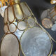 Pair of portable lamps with mother-of-pearl lampshades and brass.