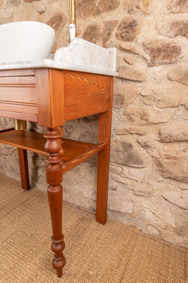 Antique washbasin cabinet in solid pitch pine with a white marble top.