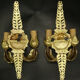 Pair of wall sconces with mask motifs in Empire style from the early 1900s - gilded bronze.