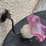 Metal wall lamp with frosted glass shade in the shape of a pink corolla