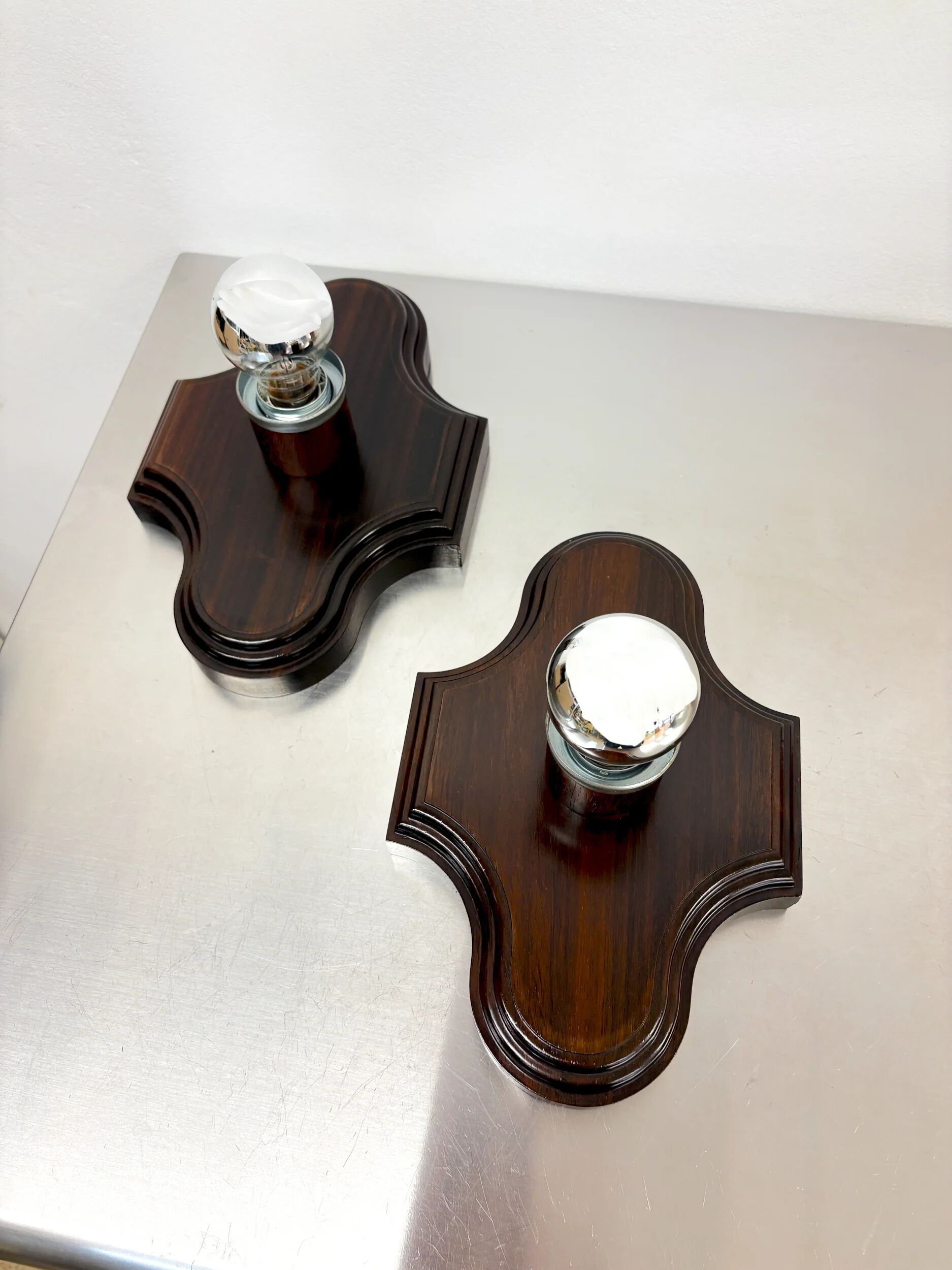 Pair of geometric Art Deco wall lights, carved wood, France, 1960s