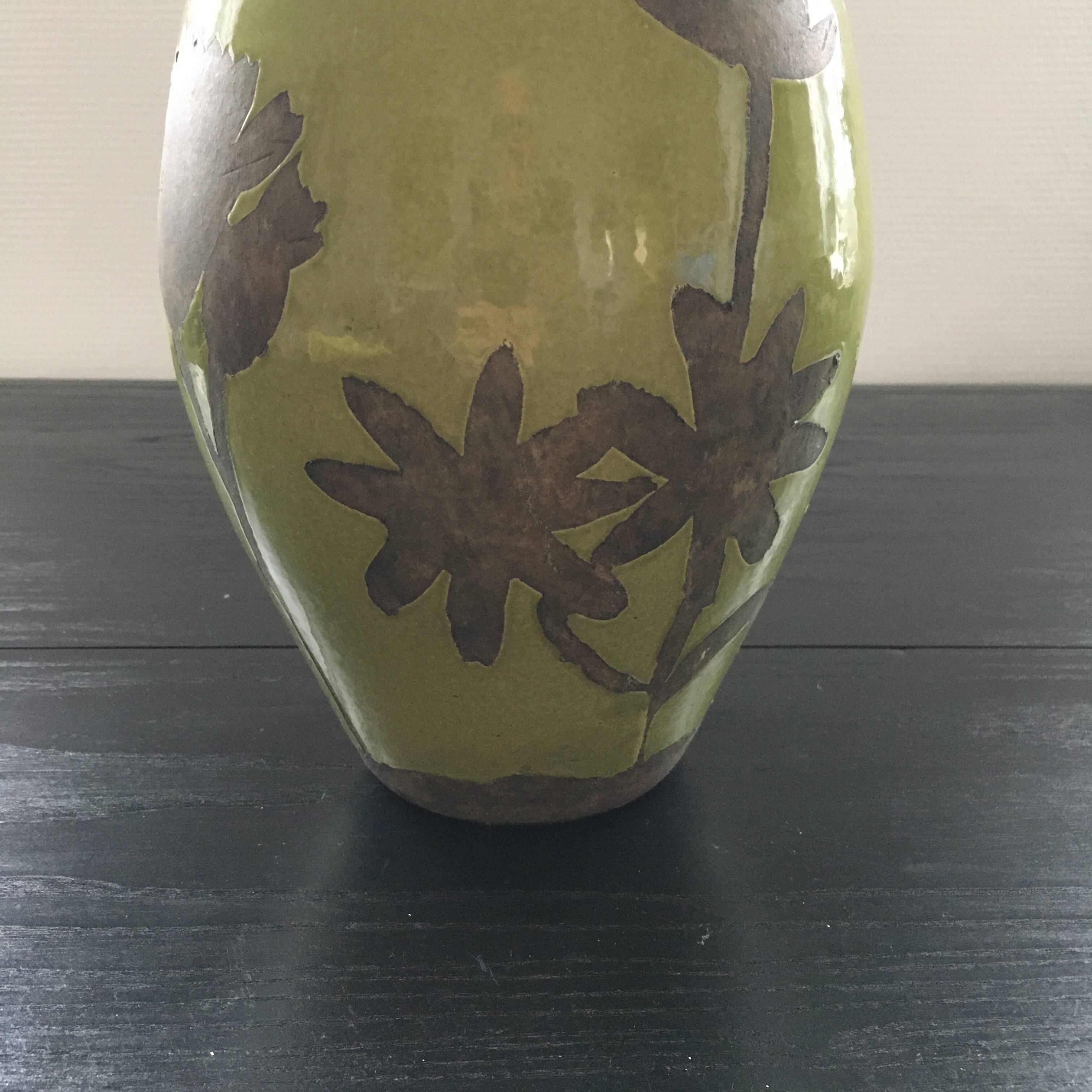 Large green vase with floral decoration