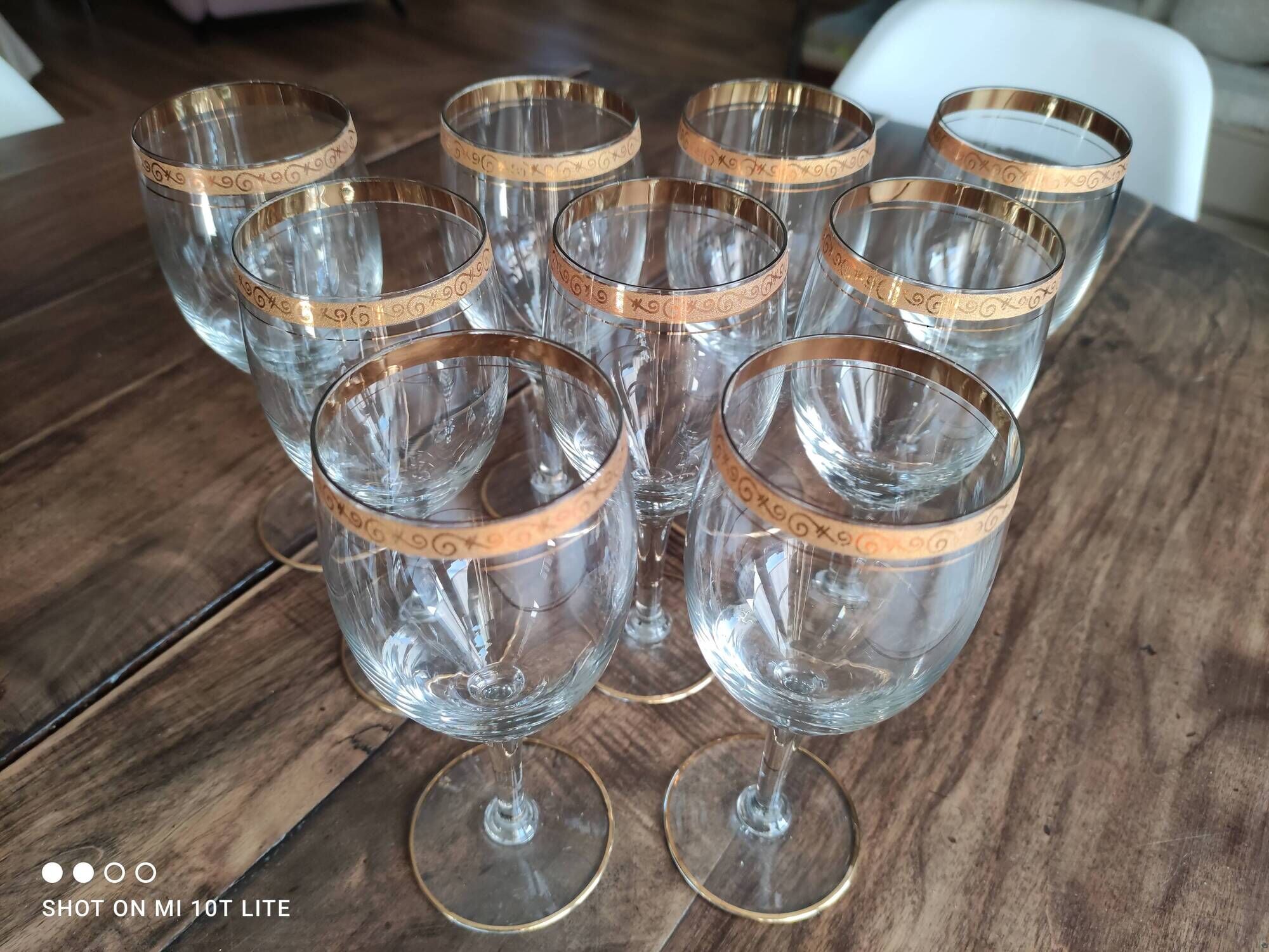 Set of 9 water or red wine glasses in crystal curled and gilded edging