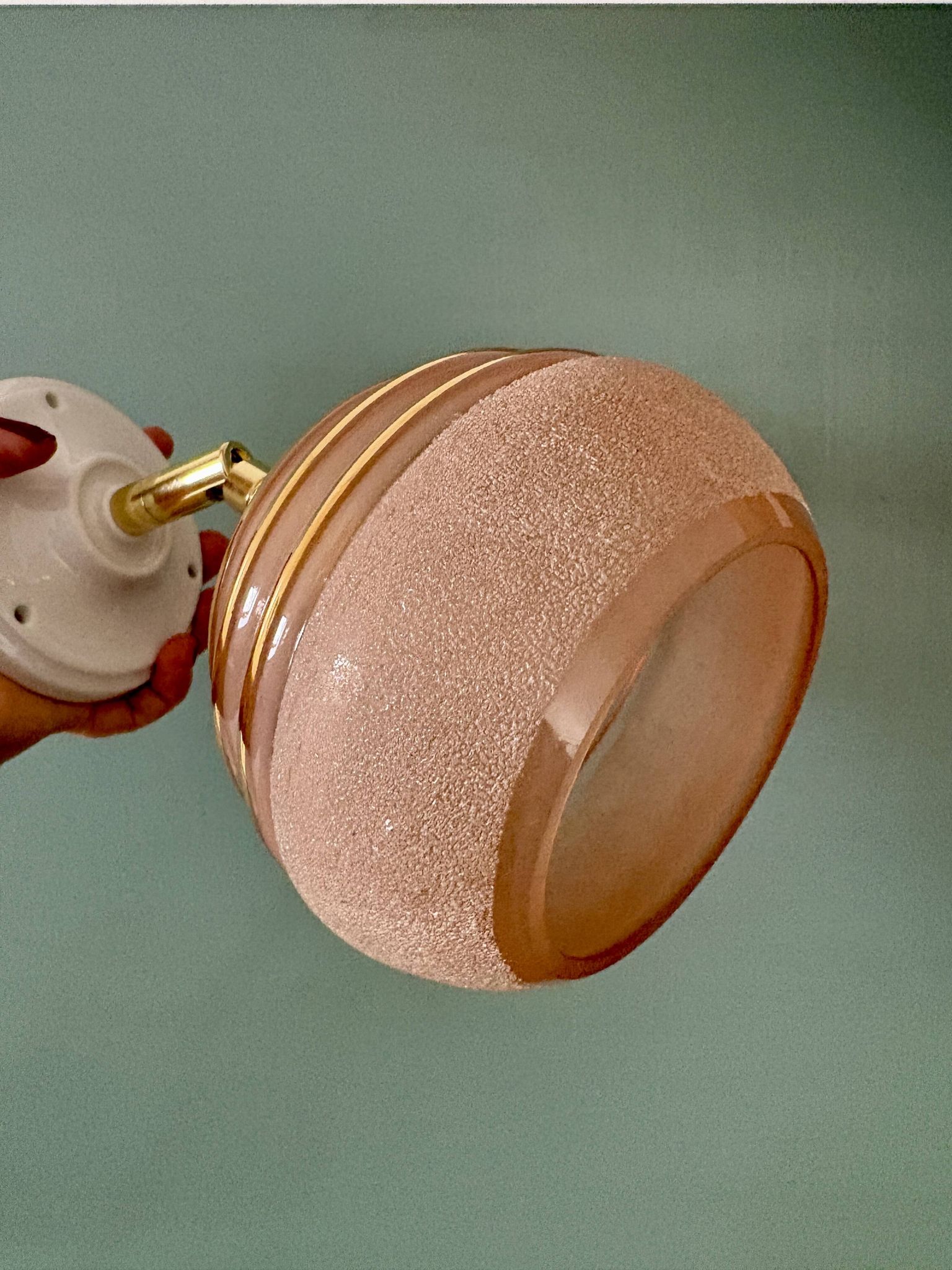Vintage globe wall light in frosted pink and gold glass.