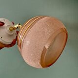 Vintage globe wall light in frosted pink and gold glass.