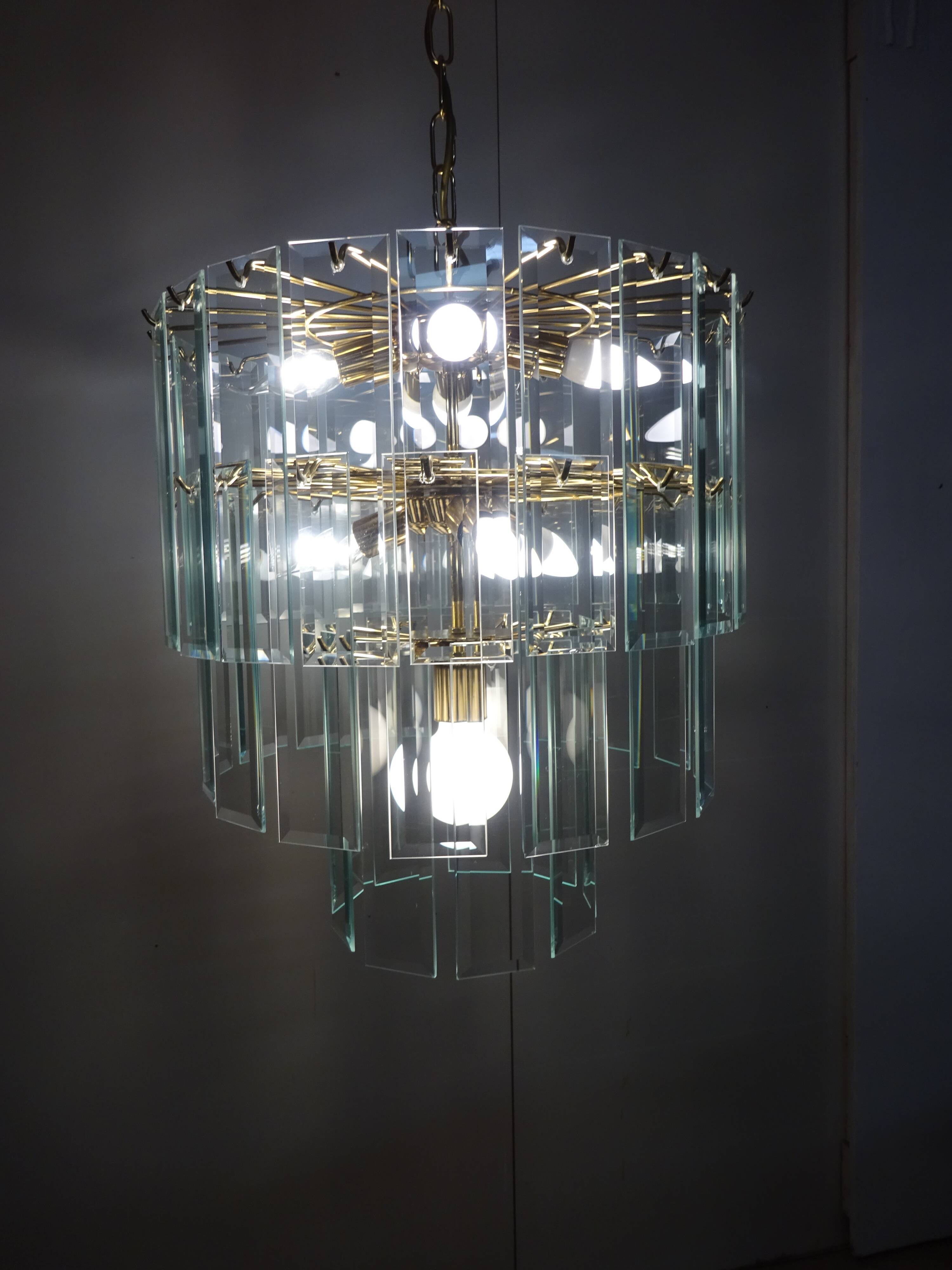 Brass chandelier and beveled glass, Italian manufacturing