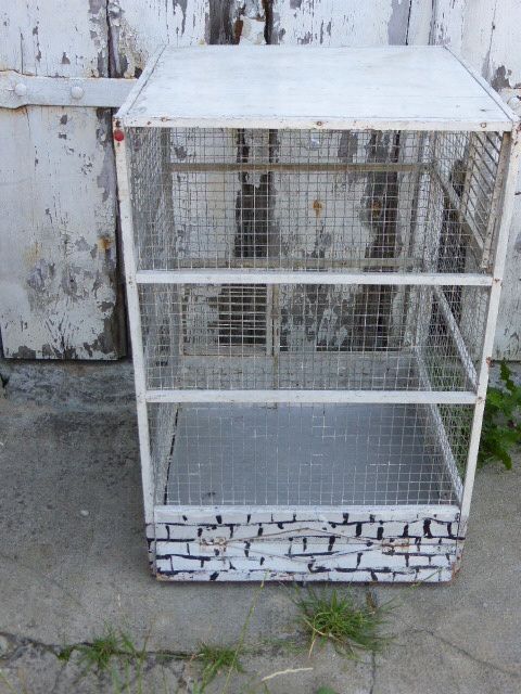 Vintage bird cage, made of wood and chicken wire metal square mesh